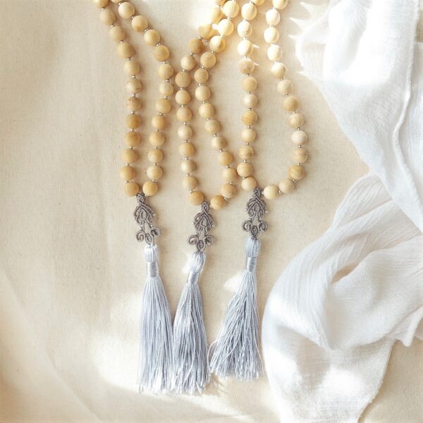 light sandalwood beaded mala necklace with macrame tassel pendant