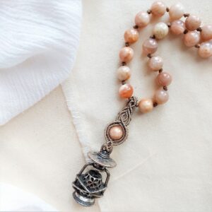 sunstone beaded necklace with macrame pendant and lantern charm