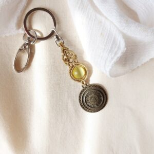 macrame keychain with medallion charm